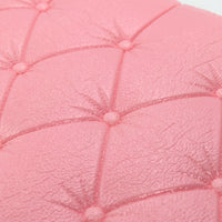 Peel-and-stick pink wallpaper with a 3D geometric pattern
