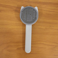 Reusable pet shedding needle comb