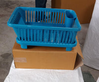 Dish drainer rack in a brown box, showing the plastic design for efficient drying