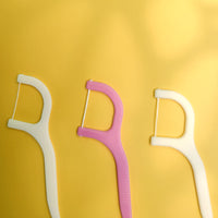 Handy floss sticks for easy tooth cleaning.