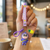 cute cartoon doll keychain with strap and pineapple charm