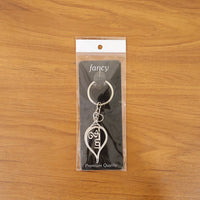 metal krishna symbol keychain